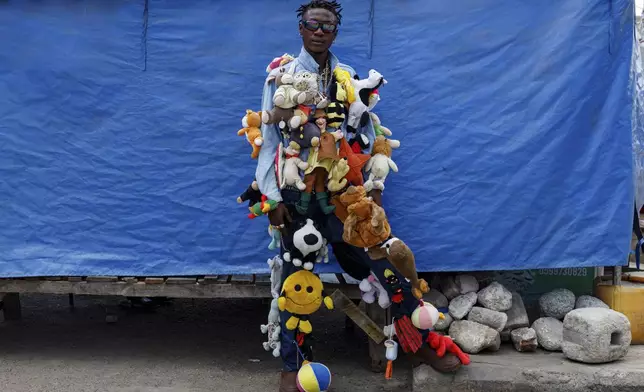 An upcycle designer poses for a photograph during a thrift and an upcycle show in Accra, Ghana, Sunday, Oct. 27, 2024. (AP Photo/Misper Apawu)