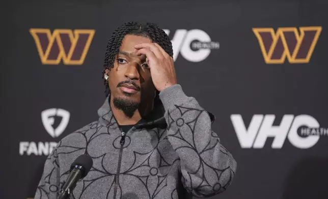 Washington Commanders quarterback Jayden Daniels pauses during a news conference following an NFL football game against the Philadelphia Eagles Thursday, Nov. 14, 2024, in Philadelphia. (AP Photo/Chris Szagola)