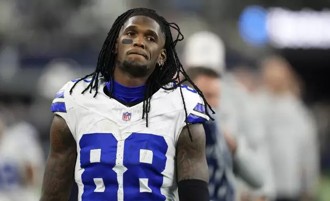 Dallas Cowboys wide receiver CeeDee Lamb walks along the sideline in the second half of an NFL football game against the Philadelphia Eagles in Arlington, Texas, Sunday, Nov. 10, 2024. (AP Photo/Jeffrey McWhorter)