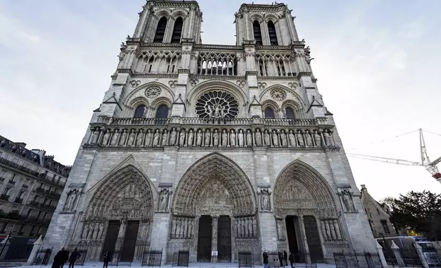 The facade of Notre-Dame de Paris cathedral in Paris, is seen Friday Nov. 29, 2024, ahead of French President Emmanuel Macron's final visit to the construction site to see the restored interiors. (Stephane de Sakutin, Pool via AP)