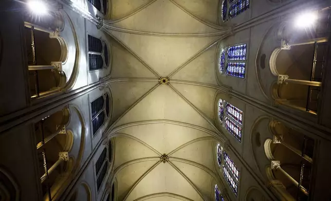 The vaulted ceiling of the Notre-Dame cathedral is seen while French President Emmanuel Macron visits the restored interiors of the monument, Friday, Nov. 29, 2024 in Paris. (Sarah Meyssonnier/Pool via AP)