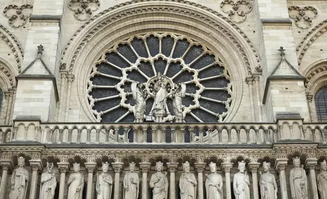 Part of the facade of Notre-Dame Cathedral is seen in Paris, Friday Nov., 29 2024 ahead of French President Emmanuel Macron's final visit to the construction site to see the restored interiors before the iconic monument's reopening for worship on Dec. 8. (Christophe Petit Tesson, Pool via AP)