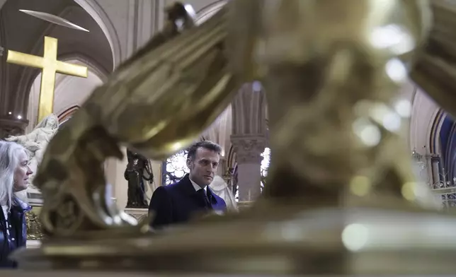 French President Emmanuel Macron visits the restored interiors Notre-Dame cathedral, Friday, Nov.29, 2024 in Paris. (Christophe Petit Tesson, Pool via AP)