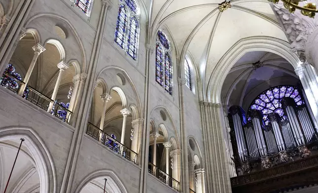 Part of the nave and the organ of Notre-Dame de Paris cathedral are seen while French President Emmanuel Macron visits the restored interiors of the cathedral, Friday Nov. 29, 2024, in Paris. (Stephane de Sakutin, Pool via AP)