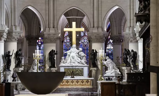 The altar designed by French artist and designer Guillaume Bardet is seen in the heart of Notre-Dame de Paris cathedral while French President Emmanuel Macron visits the restored interiors of the monument, Friday Nov. 29, 2024, in Paris. (Stephane de Sakutin, Pool via AP)
