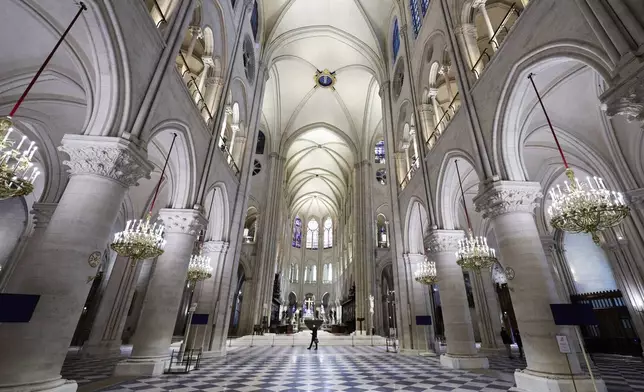 The nave of Notre-Dame de Paris cathedral is seen while French President Emmanuel Macron visits the restored interiors of the cathedral, Friday Nov. 29, 2024, in Paris. (Stephane de Sakutin, Pool via AP)