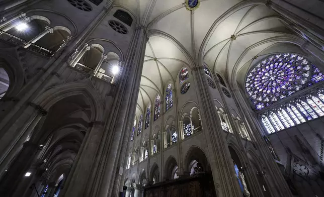 The South Rose stainglass window of Notre-Dame de Paris cathedral is seen while French President Emmanuel Macron visits the restored interiors of the cathedral, Friday Nov. 29, 2024, in Paris. (Stephane de Sakutin, Pool via AP)