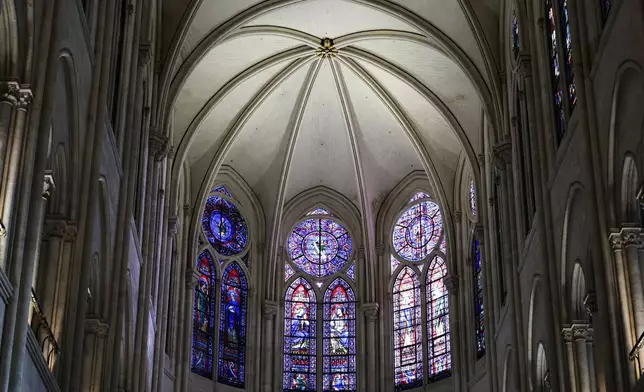 Windows in the heart of Notre-Dame de Paris cathedral are seen while French President Emmanuel Macron visits the restored interiors of the monument, Friday Nov. 29, 2024, in Paris. (Stephane de Sakutin, Pool via AP)