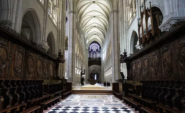 The choir stalls of Notre-Dame de Paris cathedral are seen while French President Emmanuel Macron visits the restored interiors of the monument, Friday Nov. 29, 2024, in Paris. (Stephane de Sakutin, Pool via AP)