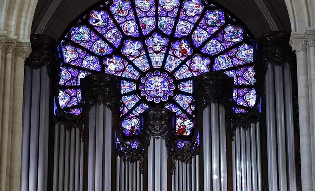 The western Rose window and the organ of Notre-Dame de Paris cathedral are seen while French President Emmanuel Macron visits the restored interiors of the monument, Friday Nov. 29, 2024, in Paris. (Stephane de Sakutin, Pool via AP)