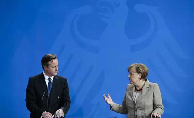 FILE - German Chancellor Angela Merkel, right, and British Prime Minister David Cameron brief the media after meeting at the chancellery in Berlin, Germany, Friday, May 29, 2015. (AP Photo/Markus Schreiber, File)