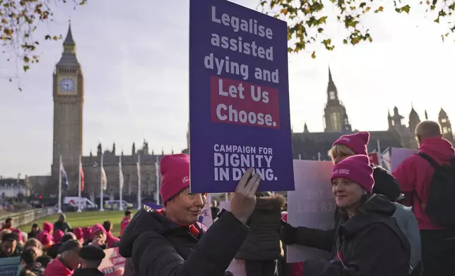 Pro legal assisted dying supporters demonstrate in front of Parliament in London, Friday, Nov. 29, 2024 as British lawmakers started a historic debate on a proposed to help terminally ill adults end their lives in England and Wales.(AP Photo/Alberto Pezzali)