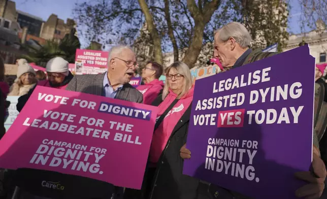 Pro legal assisted dying supporters demonstrate in front of Parliament in London, Friday, Nov. 29, 2024 as British lawmakers started a historic debate on a proposed to help terminally ill adults end their lives in England and Wales.(AP Photo/Alberto Pezzali)