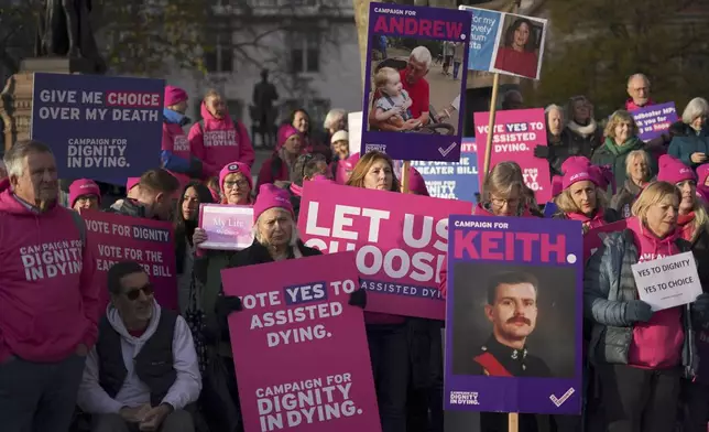 Pro legal assisted dying supporters demonstrate in front of Parliament in London, Friday, Nov. 29, 2024 as British lawmakers started a historic debate on a proposed to help terminally ill adults end their lives in England and Wales.(AP Photo/Alberto Pezzali)