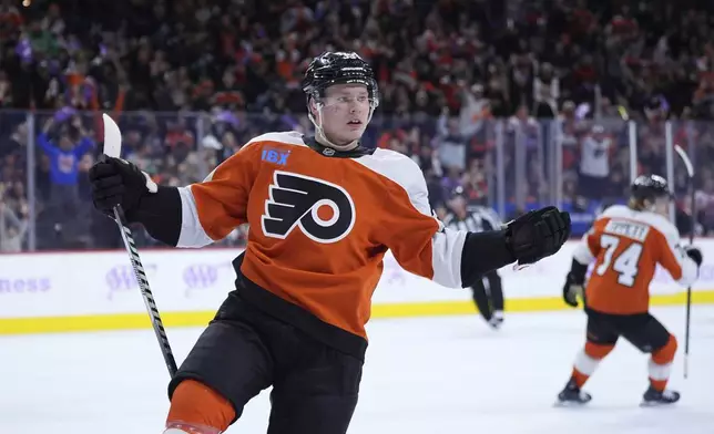 Philadelphia Flyers' Matvei Michkov reacts after scoring during the second period of an NHL hockey game against the Vegas Golden Knights, Monday, Nov. 25, 2024, in Philadelphia. (AP Photo/Matt Slocum)