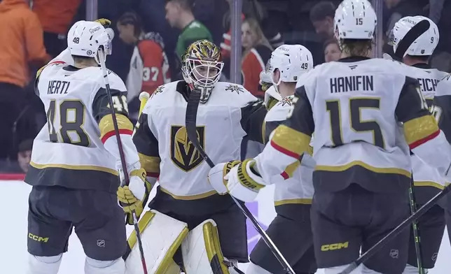 Vegas Golden Knights' Ilya Samsonov (35) celebrates after Vegas won an NHL hockey game against the Philadelphia Flyers, Monday, Nov. 25, 2024, in Philadelphia. (AP Photo/Matt Slocum)