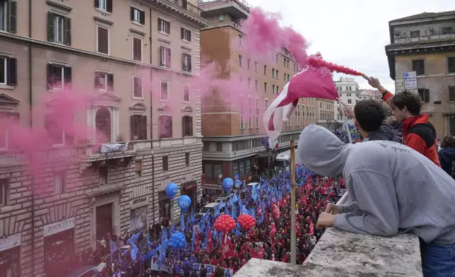 Demonstrators gather during a public and private sectors' national strike called by the labor unions to protest against government's budget law in Rome, Friday, Nov. 29, 2024. (AP Photo/Gregorio Borgia)