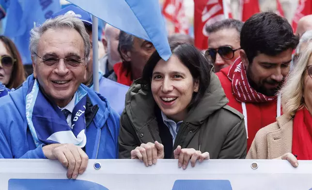 Democratic Party leader Elly Schlein, center, takes part in a demonstration organized by the Cgil and Uil unions against the government budget law during a nationwide general strike, in Rome, Friday, Nov. 29, 2024 (Roberto Monaldo/LaPresse via AP)