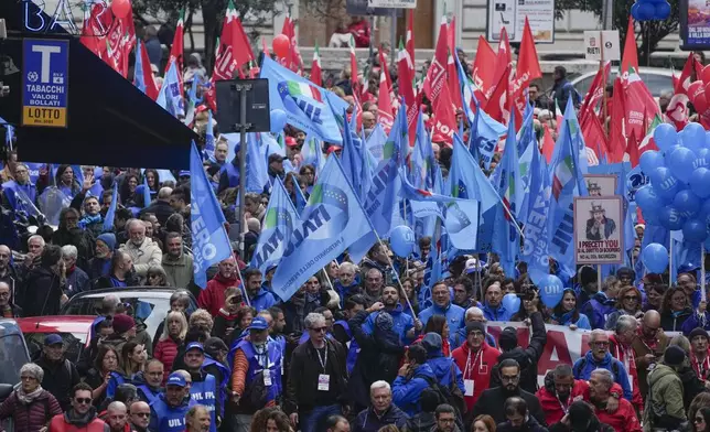 Demonstrators gather during a public and private sectors' national strike called by the labor unions to protest against government's budget law in Rome, Friday, Nov. 29, 2024. (AP Photo/Gregorio Borgia)