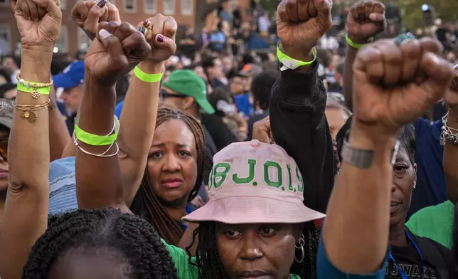 FILE - Supporters of Democratic presidential nominee Vice President Kamala Harris hold up their fists in the air in unison after she delivered a concession speech after the 2024 presidential election, Nov. 6, 2024, on the campus of Howard University in Washington. (AP Photo/Jacquelyn Martin, File)