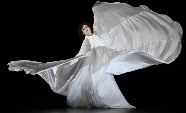 Paul Taylor Dance Company dress rehearsal performance of Jody Sperling's "Clair de Lune" featuring dancer Emmy Wildermuth at the David H. Koch Theater at Lincoln Center Wednesday, Nov. 13, 2024, in New York. (Photo by Evan Agostini/Invision/AP)