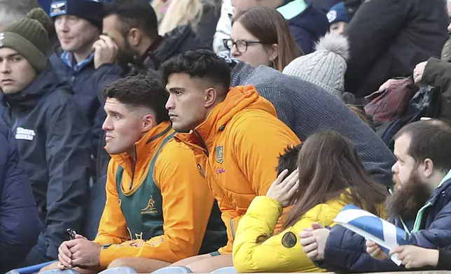 Australia's Joseph-Aukuso Suaalii, right, watches his team during the Autumn Nations series rugby union match between Scotland and Australia in Edinburgh, Sunday, Nov. 24, 2024.(AP Photo/Scott Heppell)