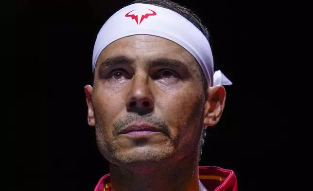 Spain's tennis player Rafael Nadal during the national anthem ahead of a Davis Cup quarterfinal match against Netherlands' Botic Van De Zandschulp at Martin Carpena Sports Hall in Malaga, southern Spain, on Tuesday, Nov. 19, 2024. (AP Photo/Manu Fernandez)