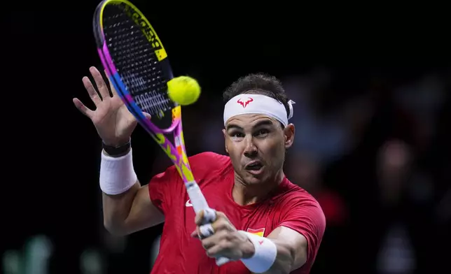 Spain's tennis player Rafael Nadal competes against Netherlands' Botic Van De Zandschulp during a Davis Cup quarterfinal match at Martin Carpena Sports Hall in Malaga, southern Spain, on Tuesday, Nov. 19, 2024. (AP Photo/Manu Fernandez)