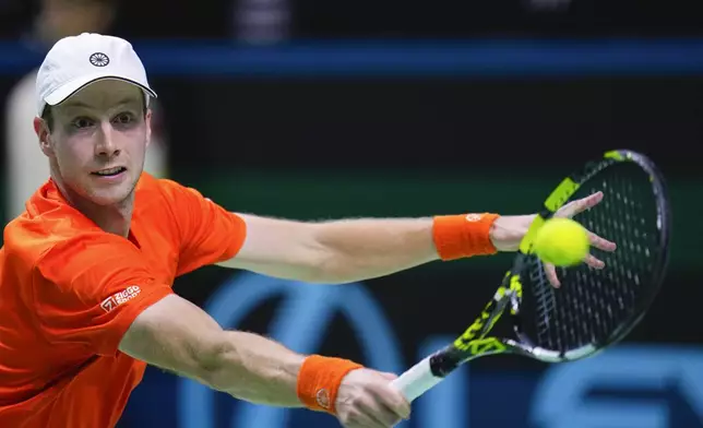 Netherlands' tennis player Botic Van De Zandschulp competes against Spain's Rafael Nadal during a Davis Cup quarterfinal match at Martin Carpena Sports Hall in Malaga, southern Spain, on Tuesday, Nov. 19, 2024. (AP Photo/Manu Fernandez)