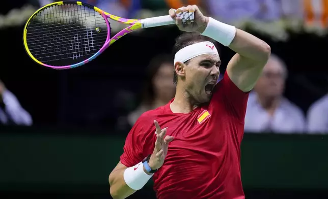 Spain's tennis player Rafael Nadal competes against Netherlands' Botic Van De Zandschulp during a Davis Cup quarterfinal match at Martin Carpena Sports Hall in Malaga, southern Spain, on Tuesday, Nov. 19, 2024. (AP Photo/Manu Fernandez)