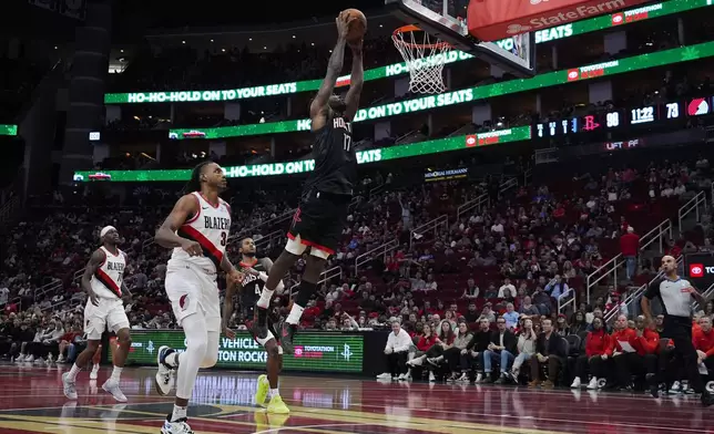 Houston Rockets forward Tari Eason (17) dunks during the second half of an Emirates NBA Cup basketball game against the Portland Trail Blazers in Houston, Friday, Nov. 22, 2024. (AP Photo/Ashley Landis)