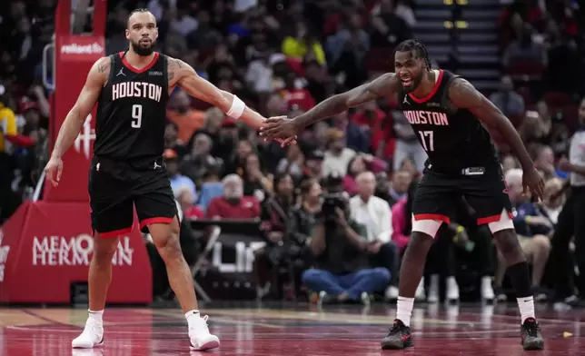 Houston Rockets forward Dillon Brooks (9) celebrates with forward Tari Eason (17) after making a 3-pointer during the second half of an Emirates NBA Cup basketball game against the Portland Trail Blazers in Houston, Friday, Nov. 22, 2024. (AP Photo/Ashley Landis)