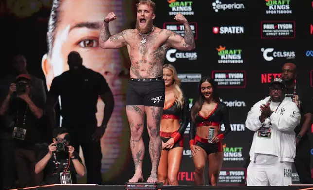 Jake Paul steps on the scale during a weigh-in ahead of his heavyweight bout against Mike Tyson, Thursday, Nov. 14, 2024, in Irving, Texas. (AP Photo/Julio Cortez)