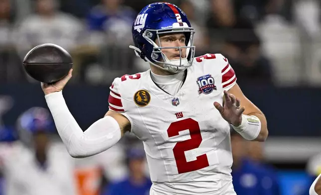 New York Giants quarterback Drew Lock (2) throws against the Dallas Cowboys during the first half of an NFL football game in Arlington, Texas, Thursday, Nov. 28, 2024. (AP Photo/Jerome Miron)