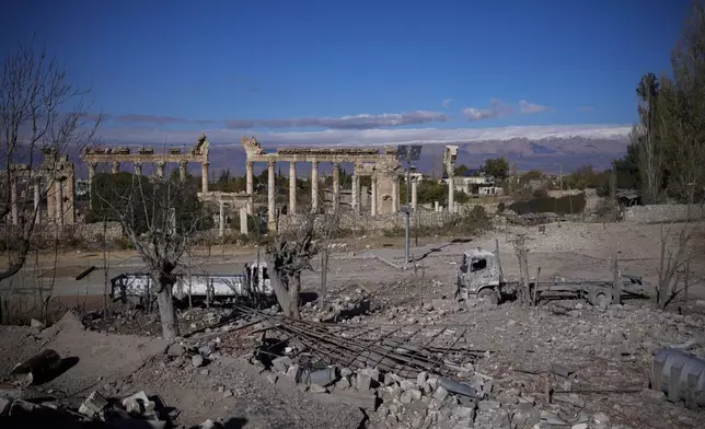 Damaged vehicles seen in front of the Roman temples of Baalbek in eastern Lebanon, Thursday, Nov. 28, 2024. (AP Photo/Hassan Ammar)