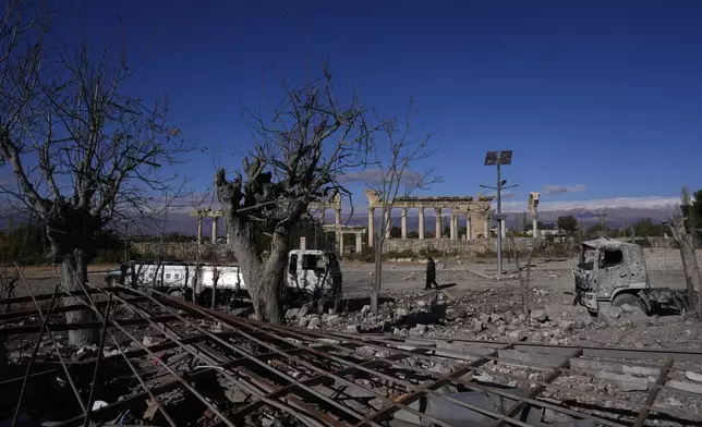 Damaged vehicles seen in front part of the Roman temples of Baalbek in eastern Lebanon, Thursday, Nov. 28, 2024. (AP Photo/Hassan Ammar)