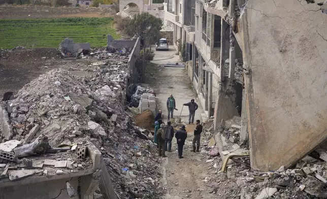 Residents start rebuilding their houses damaged in Israeli airstrikes, in Baalbek, eastern Lebanon, Thursday, Nov. 28, 2024. (AP Photo/Hassan Ammar)