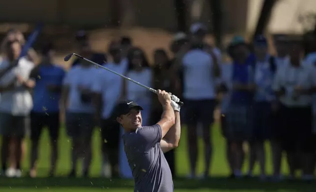 Rory McIlroy of Northern Ireland plays his second shot on the 2nd hole during the second round of World Tour Golf Championship in Dubai, United Arab Emirates, Friday, Nov. 15, 2024. (AP Photo/Altaf Qadri)