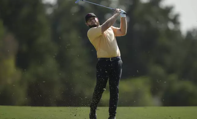 Tyrell Hatton of England plays his second shot on the 2nd hole during the second round of World Tour Golf Championship in Dubai, United Arab Emirates, Friday, Nov. 15, 2024. (AP Photo/Altaf Qadri)