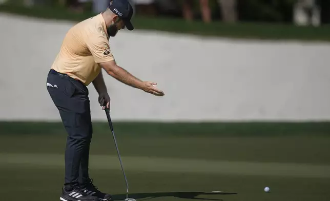 Tyrell Hatton of England reacts after he missed a shot on the 13th green during the second round of World Tour Golf Championship in Dubai, United Arab Emirates, Friday, Nov. 15, 2024. (AP Photo/Altaf Qadri)