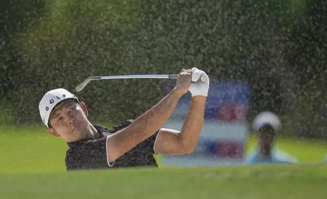 Keita Nakajima of Japan hits a shot from a bunker on the 4th hole during the second round of World Tour Golf Championship in Dubai, United Arab Emirates, Friday, Nov. 15, 2024. (AP Photo/Altaf Qadri)