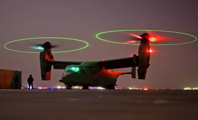 FILE - A V-22 Osprey tilt rotor aircraft taxi's during a mission in western Iraqi desert, Oct. 13, 2008. (AP Photo/Dusan Vranic, File)