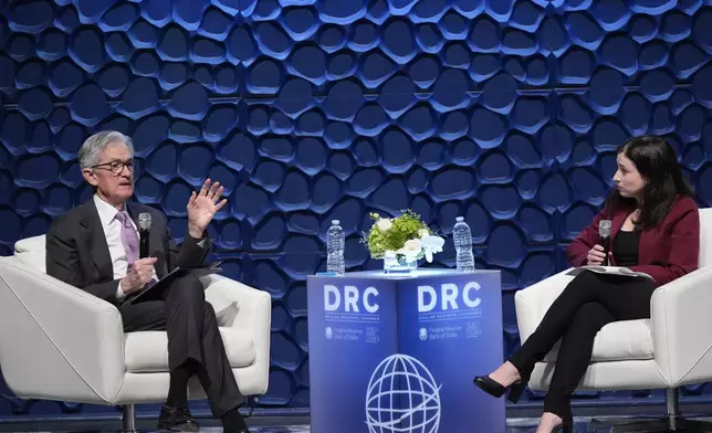 Federal Reserve Chair Jerome Powell, left, speaks to the Dallas Regional Chamber as moderator Catherine Rampell looks during an event in Music Hall at Fair Park Thursday, Nov. 14, 2024, in Dallas. (AP Photo/LM Otero)