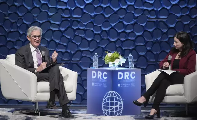 Federal Reserve Chair Jerome Powell, left, speaks to the Dallas Regional Chamber as moderator Catherine Rampell looks during an event in Music Hall at Fair Park Thursday, Nov. 14, 2024, in Dallas. (AP Photo/LM Otero)