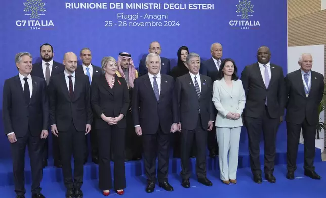 Front row from left, U.S. Secretary of State Antony Blinken , French Foreign Minister Jean-Noël Barrot, Canada's Foreign Minister Melanie Joly, Italian Foreign Minister Antonio Tajani, Japanese Foreign Minister Takeshi Iwaya, German Foreign Minister Annalena Baerbock, Britain's Foreign Secretary David Lammy, and European Union foreign policy chief Josep Borrell pose for a family photo with, second row from left, foreign Ministers of Quatar, Mohammed Abdulaziz Al-Khulaifi, Egypt, Badr Ahmed Mohamed Abdelatty, Saudi Arabia, Faisal Farhan Al Saud, Jordan, Ayman Safadi, United Arab Emirates, Reem Ebrahim Al Hashimy, and Secretary-General of the Arab League, Ahmed Aboul-Gheit at the G7 of foreign Ministers in Fiuggi, some 70 kilometers south-east of Rome, Monday, Nov. 25, 2024. (AP Photo/Alessandra Tarantino)