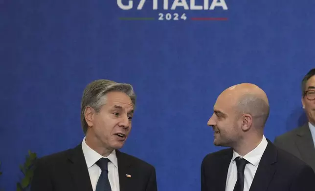 U.S. Secretary of State Antony Blinken, left, and foreign Ministers of France, Jean-Noël Barrot, wait for the family photo at the G7 of foreign Ministers in Fiuggi, some 70 kilometers south-east of Rome, Tuesday, Nov. 26, 2024. (AP Photo/Alessandra Tarantino, Pool)