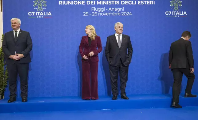 From left, Ukrainian Foreign Minister Andrii Sybiha, Canada's Foreign Minister Melanie Joly, Italian Foreign Minister Antonio Tajani, and Britain's Foreign Office Political Director Christian Turner arrive for a family photo at the G7 of foreign Ministers in Fiuggi, some 70 kilometers south-east of Rome, Tuesday, Nov. 26, 2024. (AP Photo/Alessandra Tarantino, Pool)