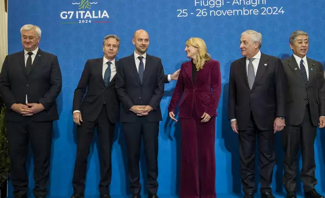 From left, Ukrainian Foreign Minister Andrii Sybiha, U.S. Secretary of State Antony Blinken, French Foreign Minister Jean-Noël Barrot, Canada's Foreign Minister Melanie Joly, Italian Foreign Minister Antonio Tajani, and Japanese Foreign Minister Takeshi Iwaya prepare for a family photo at the G7 of foreign Ministers in Fiuggi, some 70 kilometers south-east of Rome, Tuesday, Nov. 26, 2024. (AP Photo/Alessandra Tarantino, Pool)