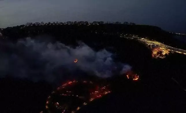 This aerial image taken from video shows a brush fire that broke out in a park on the northern tip of Manhattan in Inwood, N.Y., Wednesday, Nov. 13, 2024. (WABC-TV via AP)