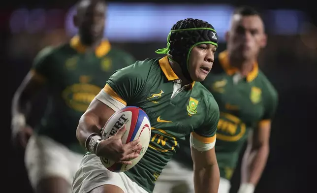 South Africa's Cheslin Kolbe, runs over the line to score a try during the Autumn Nations series rugby union match between England and South Africa, at Twickenham, in London, Saturday, Nov. 16, 2024. (AP Photo/Kin Cheung)